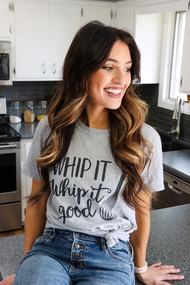 Mollie wearing 'whip it, whip it good' shirt